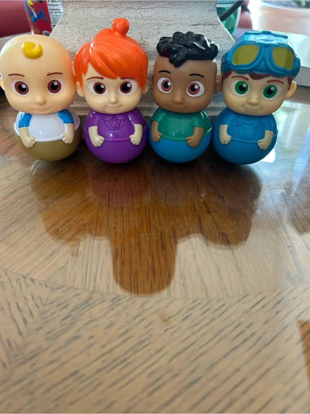 Cocomelon Wobble Toy Set of four- Purple, Blue, Green, Brown
